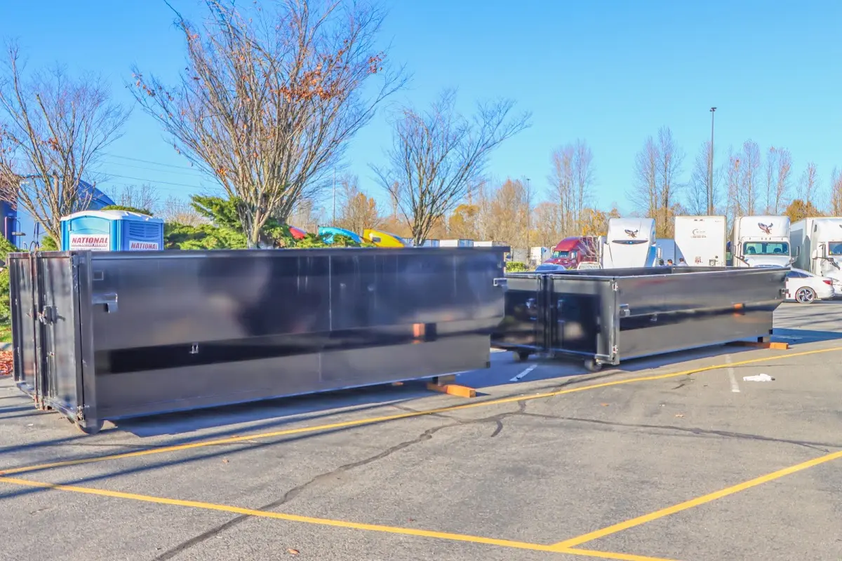 Professional dumpster rental service with roll-off container on residential driveway in Encinitas